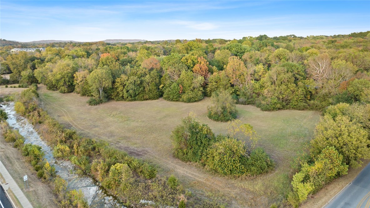 Wow! Nearly 9 acres in city limits of Fayetteville on the east side at the intersection of Crossover and Old Wire. One existing home, but the value is in the land. Potential for development. Zoned RSF4. This property is truly a gem and you won't find another like it. Crossover frontage 30'. Approximate dimensions 870'x450'. Old Wire borders 2 sides of property. Partially cleared. Also listed in land MLS 1287368