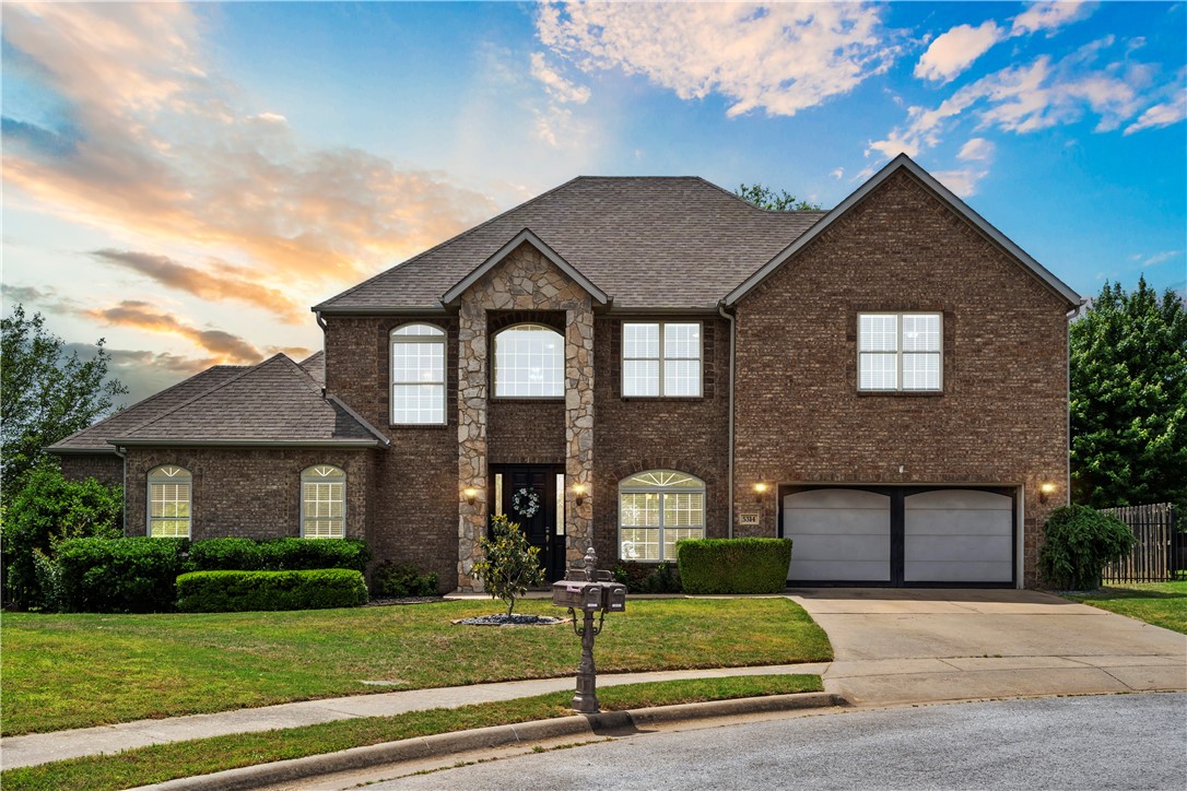 Open House — Sunday, May 18th | 2:00–4:00 PM. Elegant home in the sought-after Hearthstone Subdivision with Bentonville Schools! Enjoy soaring ceilings, beautiful trim work, and large windows that fill the home with natural light. The formal dining room features classic wainscoting and wood flooring. The living room boasts two-story ceilings and a cozy fireplace. The kitchen is equipped with Brazilian quartzite countertops, stainless appliances, and a breakfast nook overlooking the backyard. The main-level primary suite includes a jetted tub, tiled shower, and dual vanities. Upstairs you'll find spacious bedrooms and a large full bath with excellent storage. The back deck is perfect for entertaining or relaxing. Neighborhood amenities include a pool, playground, and clubhouse. Conveniently located near trails, dining, and shopping in NWA.