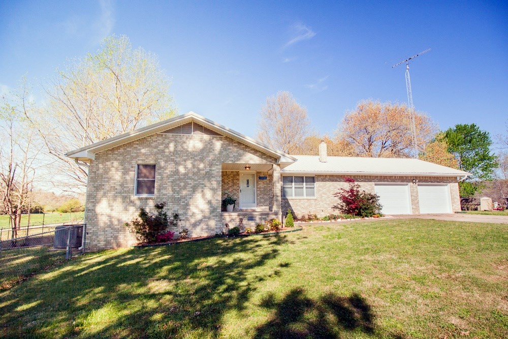 Welcome to your lake oasis! This home sits on a level 1+ acre with lake access and a lovely lake view. New amenities include: Furnace/HVAC/Roof/1,000 gal propane tank/water heater. Enjoy the peaceful lake ambiance on the covered patio or in the spacious htd/cooled sunroom.
