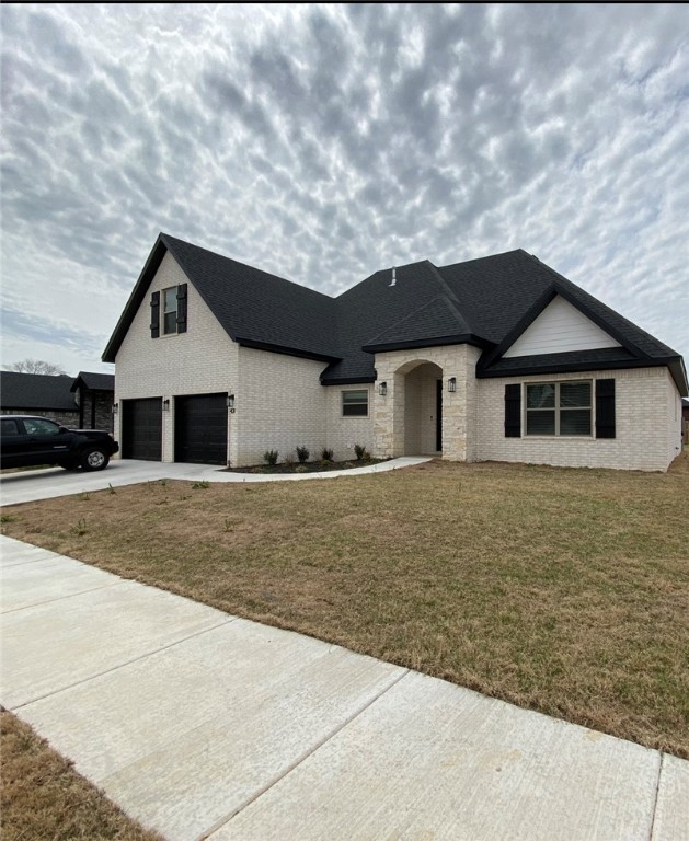 Better than new!! Split floor plan with a 4th bedroom/bonus room with a half bath upstairs. Each family member can have their own space. The open Kitchen, Dining and Living Room is the center of the home for relaxing or gathering with friends. The outside has a covered patio with fire pit along with a great place for a tv. The attached storage/workshop was a custom add on from the home owner. It is perfectly placed to be easily accessible from the backyard without the look of an add on storage building. A great addition!! There are built in's and lots of storage. Open every door so that you can see all this home has to offer. Ring doorbell, programable thermostat and keyless entry makes this home a perfect secure place to come home to. A great location to Fayetteville and all of NW Arkansas.