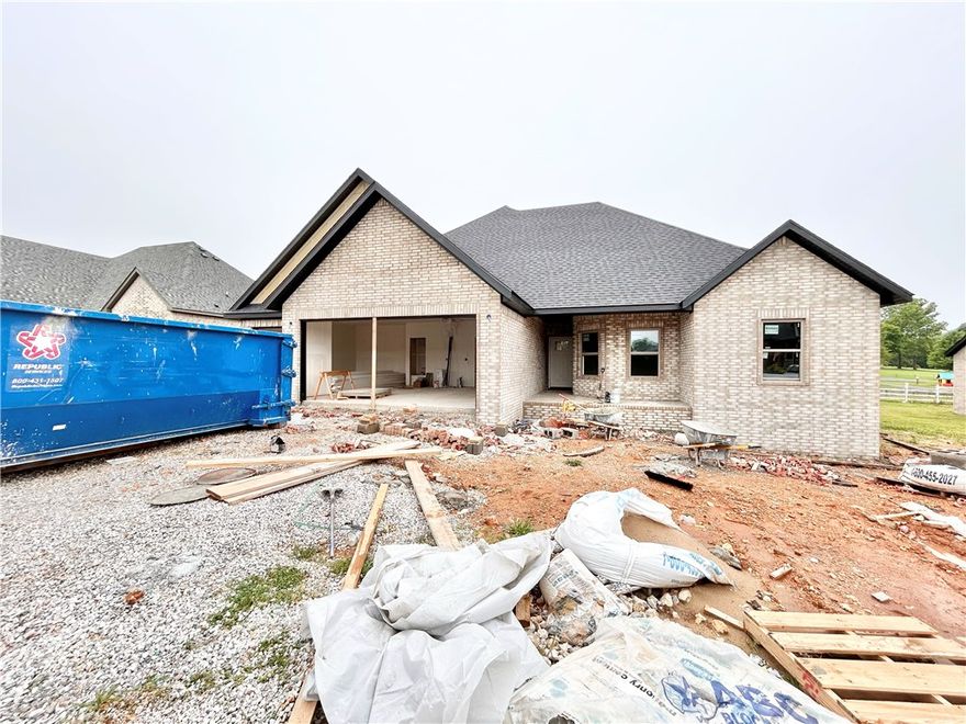TO BE BUILT. Perfect time for you to pick out finishes! Discover the "Cambridge" plan, ideally situated close to the Pea Ridge High School and trails! Just 15 minutes from the new Walmart Campus! This beautiful home features 4 spacious bedrooms / 2.5 baths and a split floor plan. Enjoy the flexibility of a 3-car garage and the elegance of custom cabinets throughout. The kitchen includes a gas range and a huge island perfect for gatherings. Step out to the covered patio for outdoor relaxation and entertaining. $5,000 in buyer's closing costs from the builder's preferred lender. Schedule your showing today!