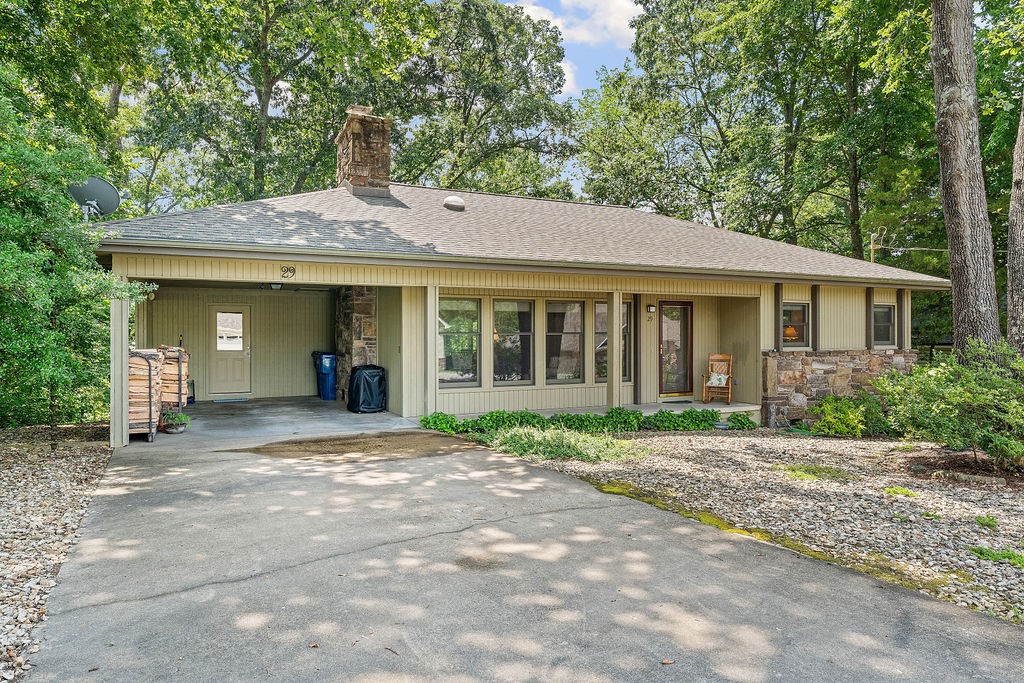 Cute as can be! Craftsman style decor, welcoming wood-burning fireplace can heat the entire house! Stunning real hardwood floors, open living/dining/kitchen plan. Delightful sunroom is like being in a treehouse! Be sure to check out the hexagonal deck down below near the woods!