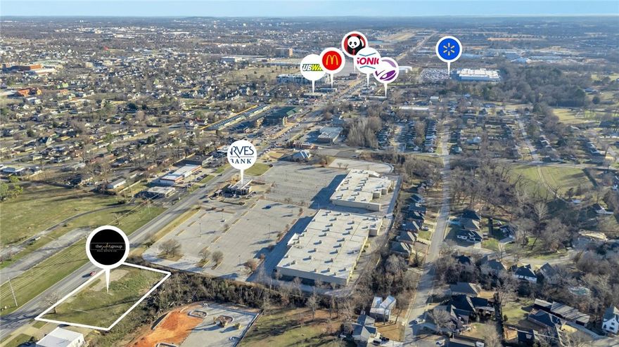 High-visibility Bentonville development opportunity on Walton Blvd (Hwy 71B) with 40,000+ vehicles passing daily. This offering includes two parcels totaling approx. 0.57 acres, sold together only, creating a deeper footprint for redevelopment. The front parcel (01-00878-000 | approx. 0.33 acres) provides direct Walton Blvd frontage and strong exposure. The rear parcel (01-00888-000 | approx. 0.24 acres) sits directly behind and adds space for parking, storage, expanded building footprint, or flexible site planning (subject to zoning/city approval). A structure previously existed on site and utilities have historically served the property (buyer to verify availability, capacity, and connection fees). Surrounded by major employers, retail, restaurants, and the regional trail system, this is a rare opportunity to secure Walton Blvd frontage with additional depth in a high-traffic corridor.