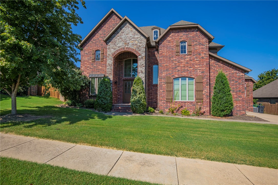 Beautiful home in Rogers. Open floor plan, beamed ceilings, Spacious kitchen with 2 pantries and center island. Gas cooktop, granite counters. Master suite large features separate shower and tub, with closet adjoining the laundry room also have a safe room in master closet. Large covered patio with outdoor fireplace. Community pool & playgrounds. Close to shopping, social amenities and schools. This home has it all!