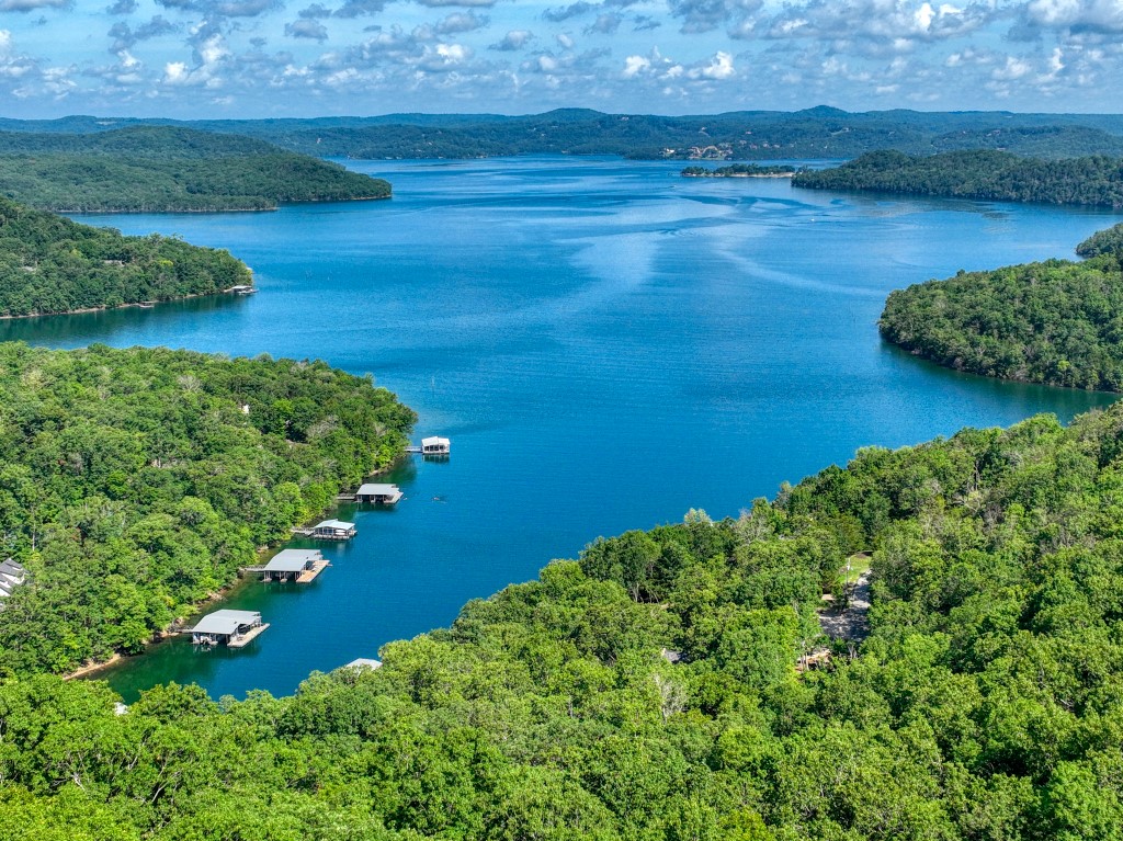 Unwind while watching boats and the sunset! This lot has a very large view of the main channel of Beaver Lake, allowing you to look down on the water close to you, as well as seeing far down the lake. This property is very easy to get to via paved Mundell Road and it allows quick access to Eureka Springs. Starkey Marina, Beaver Dam, and the White River are all very close by! This excellent lot is ready for your vision!
