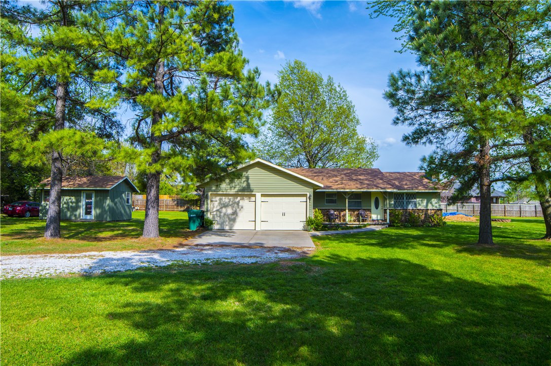 Amazingly convenient to all of NWA! This adorable home has been remodeled with a newer kitchen & both bathrooms! New roof, new HVAC & recently hooked up to City of Bethel Heights STEP system. House sits on .90 acres not in a S/D. Price includes the attached lot of .38 acres which is part of Oak Place S/D. 195 SF shop is ideal for extra storage or a workshop/craft area. 3BR, 2BA, 2CAR.