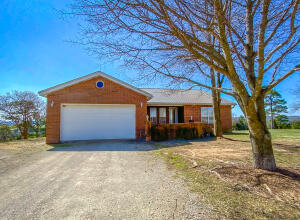 Spectacular View that you MUST see to appreciate. This is a 5 bedroom 4 bath all brick house with 52.84 acres m/l. The house has two full kitchens, large bedrooms and 2 living areas. There is a 40x60 shop with a garage door, lots of storage and an apartment with a full bath. The well has always serviced the property, rural water is also available. Whitetail deer and other wildlife are plentiful on the property. All #'s approximate,