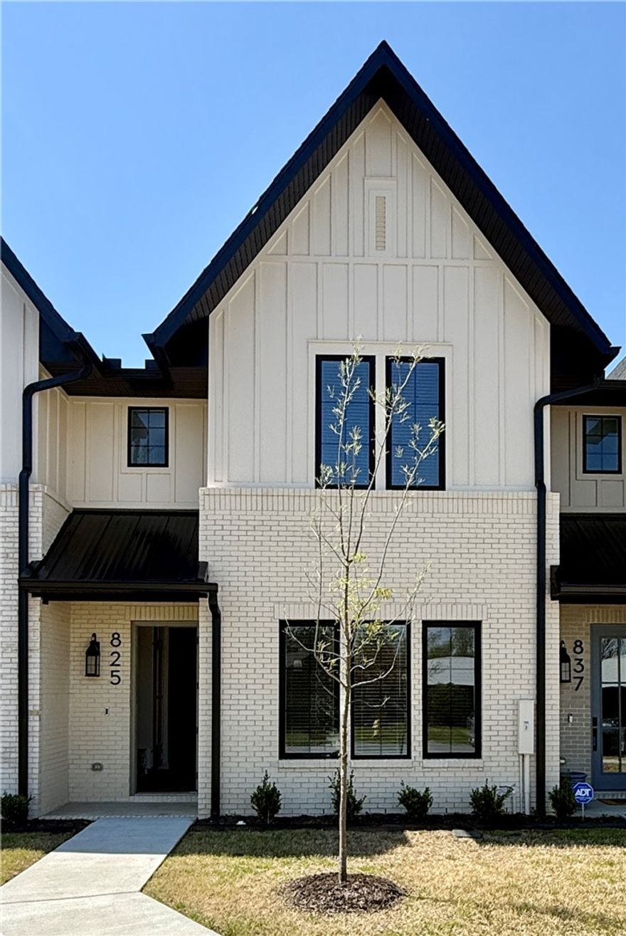 Beautiful new construction townhome in a great Bentonville location—just 0.7 miles from the vibrant Downtown Square! This thoughtfully designed 2 level home offers 3 bedrooms, 2.5 baths, and a modern layout.
All bedrooms are located on the 2nd level, each featuring walk-in closets for ample storage. The primary suite includes a private sitting area at the entrance—ideal for a reading nook . Upstairs also features a small 2nd living area at top of stairs.
The main level boasts 10-foot ceilings, creating an open and airy feel, while the  2nd level features 9-foot ceilings. The kitchen is equipped with stylish GE Cafe appliances, including a refrigerator, soft-close cabinetry, and modern finishes.
Additional highlights include a tankless water heater, keyless entry, and a 2-car garage with EV charging plugs.
Enjoy convenient access to shopping, dining, and entertainment, close proximity to Crystal Bridges Museum, nearby bike trails, walking paths, and quick access to I-49, walk to Walmart neighborhood market.