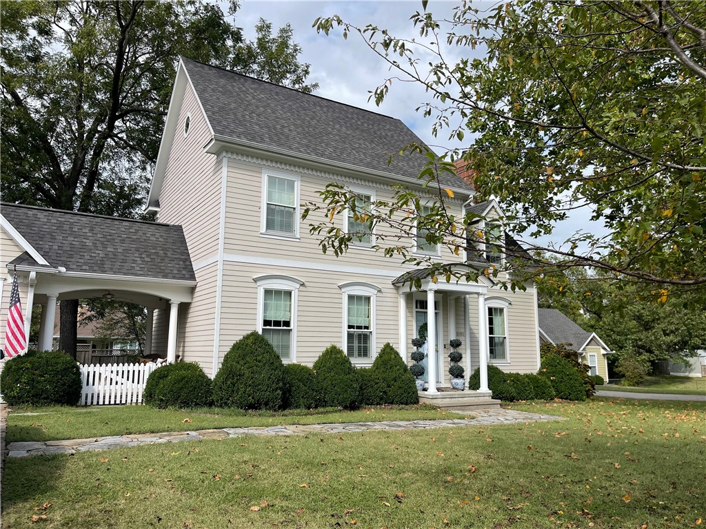 Custom-Built American Georgian Home – Quality, Character & Comfort! Discover timeless craftsmanship in this beautifully built three-level Georgian-style home, featuring a finished basement with carpeted floors, a bonus room or office, and a secure safe room. A grand open “U”-shaped staircase sets the tone, with solid oak plank flooring throughout the main level and a hardwood staircase with a classic carpet runner leading to three spacious, carpeted bedrooms upstairs. The chef-inspired kitchen offers premium upgrades including a Sub-Zero refrigerator, Bosch whisper-quiet dishwasher, convection wall oven, built-in microwave, granite countertops, and a hand-painted Delft porcelain tile backsplash. Enjoy energy efficiency year-round with 2x6 exterior walls and high-grade cellulose insulation in walls, ceilings, and floors—designed to keep utility costs low. Outdoor spaces include a charming slate walkway, a brick patio perfect for entertaining, and a lovely covered porch that connects the garage to the main home.