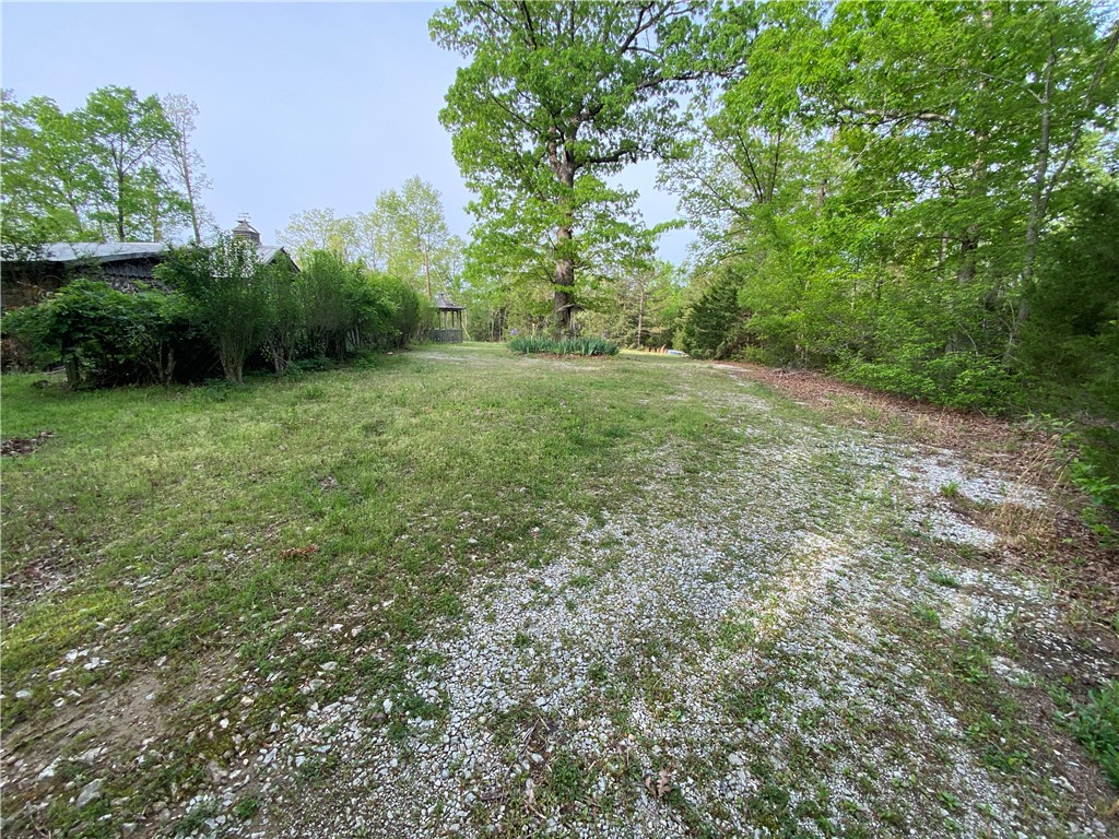 Fixer upper cabin/home on 19.71 acres with good views in the Buffalo National River Region in the Ozark Mountains of beautiful Newton County, Arkansas. This parcel is only 3.5 miles north of Jasper just off Hwy 7 and just 3 miles from the Pruitt Access of the Buffalo National River. Excellent piece of land that can be split up with multiple building sites. Good stand of hardwood timber. Excellent wildlife habitat for deer, turkey and small game for hunting. Near the Ozark National Forest. This area provides outstanding recreational opportunities of the Ozark National Forest and Buffalo National River Region. This central location is convenient to the best swimming holes, hiking, canoeing, wildlife photography and fishing. Other nearby outdoor activities include horseback riding, mountaineering, caving and scenic driving.