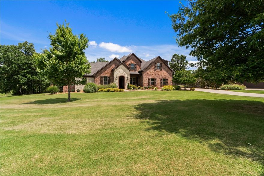 Discover a rare opportunity to own a beautifully maintained all-brick home nestled on a massive lot spanning over 2 acres—the largest in this enchanting West Fayetteville neighborhood. This immaculate property is truly move-in ready, offering the perfect blend of space, privacy, and in pristine condition. Surrounded by mature trees and open space, this property is ideal for those seeking luxury, tranquility, convenience, and entertainment potential. The expansive lot provides endless possibilities—from a pool to a guest house or workshop. Located in a highly sought-after area that is just minutes from I-49,  a short drive from schools, shopping/dining (around 10 minutes to other parts of Fayetteville), and outdoor recreation (Lake Wedington nearby). This heavily-wooded and serene neighborhood combines an executive feel with private living, while having city amenities just minutes away. Don't miss your chance to own one of the most unique and spacious properties in West Fayetteville!