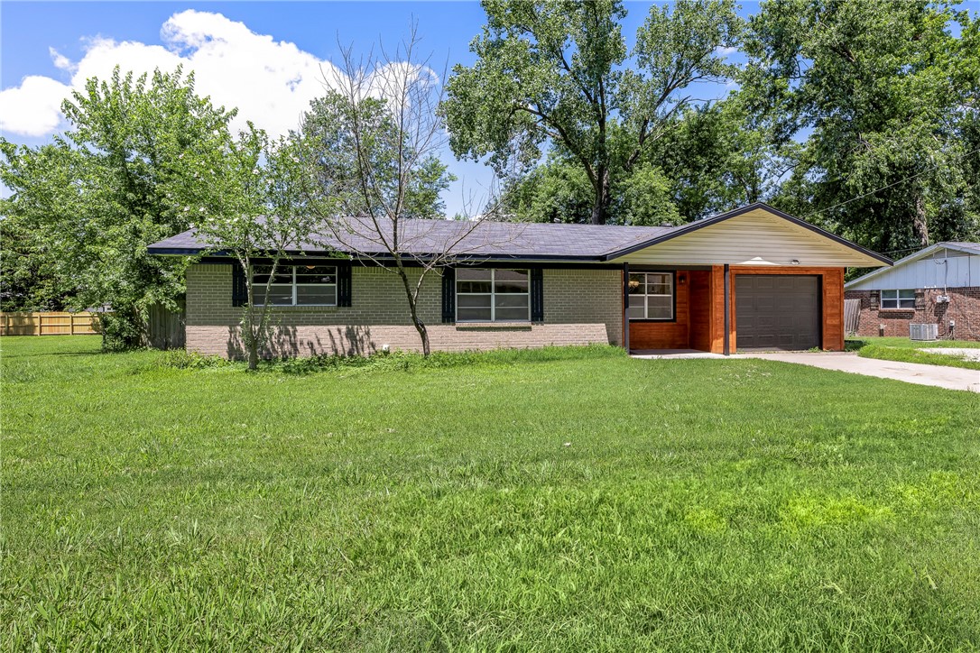Charming and move-in ready 1080 s.f. ranch featuring 3 bedrooms, 1 full bath, and a 1-car garage. Home offers numerous upgrades including a newer roof and HVAC system, brand new kitchen counters, faucets, cabinet hardware, bathroom fixtures, lighting, upgraded 220 AMP electrical panel, all new switches and outlets, new flooring throughout, and fresh paint in every room. The exterior has fresh paint on trim, deck, patio, and outbuilding, giving the home great curb appeal. Situated on a quiet street with easy access to I-49, this home is just minutes from the new Walmart Campus and all that Downtown Bentonville has to offer. Perfect for first-time buyers, investors, or anyone looking to enjoy the best of NWA living! Property sold "AS IS".