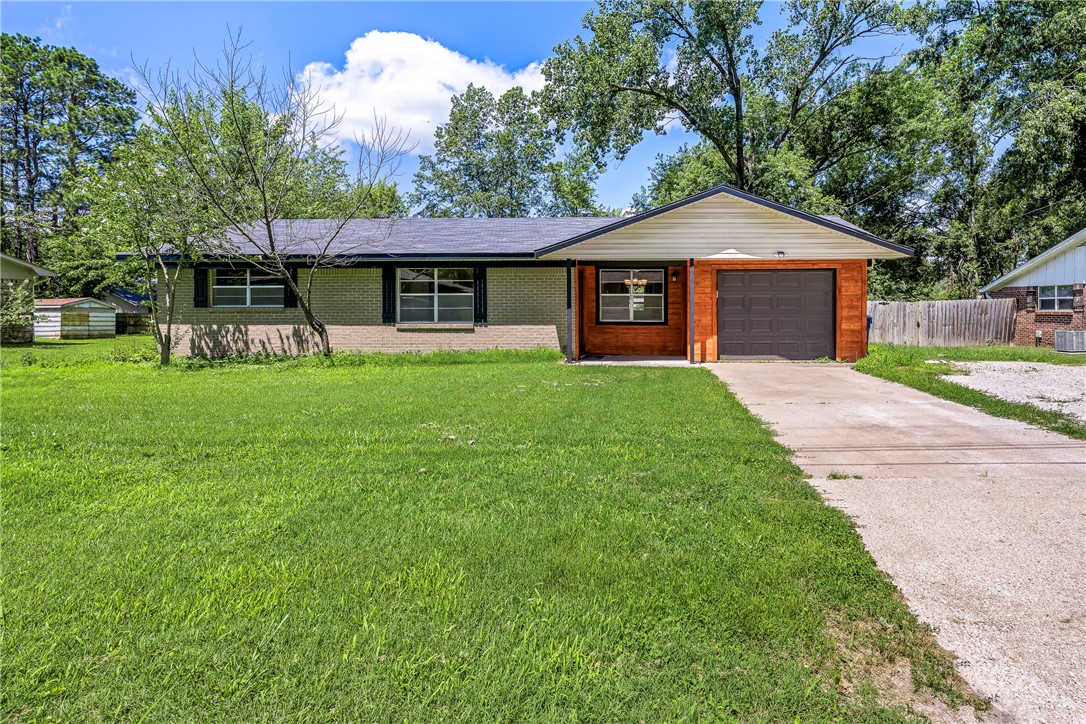 Charming and move-in ready 1080 s.f. ranch featuring 3 bedrooms, 1 full bath, and a 1-car garage. Home offers numerous upgrades including a newer roof and HVAC system, brand new kitchen counters, faucets, cabinet hardware, bathroom fixtures, lighting, upgraded 220 AMP electrical panel, all new switches and outlets, new flooring throughout, and fresh paint in every room. The exterior has fresh paint on trim, deck, patio, and outbuilding, giving the home great curb appeal. Situated on a quiet street with easy access to I-49, this home is just minutes from the new Walmart Campus and all that Downtown Bentonville has to offer. Perfect for first-time buyers, investors, or anyone looking to enjoy the best of NWA living! Property sold "AS IS".