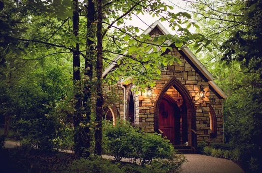 Endless Possibilities abound with the 4.7ac property located a stones throw for I49.  Current use is Wedding & Event Venue complete with Elegant Chapel, Event Hall with open air covered patio, 2 story office complete with kitchen , and picturesque outdoor setting on Puppy Creek.  Ample parking on site with wooden foot bridge connecting parking lot and venue grounds.  The only limitations with this property are your imagination.
Main features of the venue include 3 seperate buildings on site. 1300sq ft Wedding Chapel, 2900sq ft event hall with 900sq ft covered patio, and Office building/wedding party building with seperate quarters for bridal and groom parties.  Site also features adjacent 55+ spot parking lot that attaches with covered wooden foot bridge crossing the year round Puppy Creek which is also next to the Razorback Trail system.  The entire 4.7 acres is shaded with natural fauna of NWA and enhanced with full landscaping throughout. You will have to see it to believe...