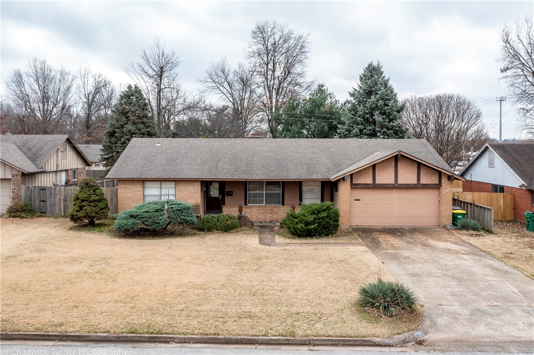 This 1965 1-story, full brick, 1,642sqft home with 3-bedroom, 2-bath, 2-car attached garage, level back & front yard, laundry room/storage cabinets, built in desk caddy with cabinets above in kitchen & dining area off kitchen & living areas (family room and living room), gas log & wood burning fireplace with a wood mantle and built-in display shelves in brick wall, back patio access from master bedroom, original windows, attic access off the garage, front covered porch, roof replaced in 2010, Heating system has been updated in 2013, AC unit is original but fan blade replaced, hot water tank is 2017, and all heating and cooling and hot water tank and appliances are in good working condition and the Seller is offering Home Warranty with acceptable offers, all appliances present to convey including: stove, oven (new in 2020), dishwasher, refrigerator, washer & dryer. Wood fencing on 3-sides of backyard with gate. Great starter home or rental with easy access to Hwy 412/W Sunset Ave & I-49 (Seller to make no repairs)