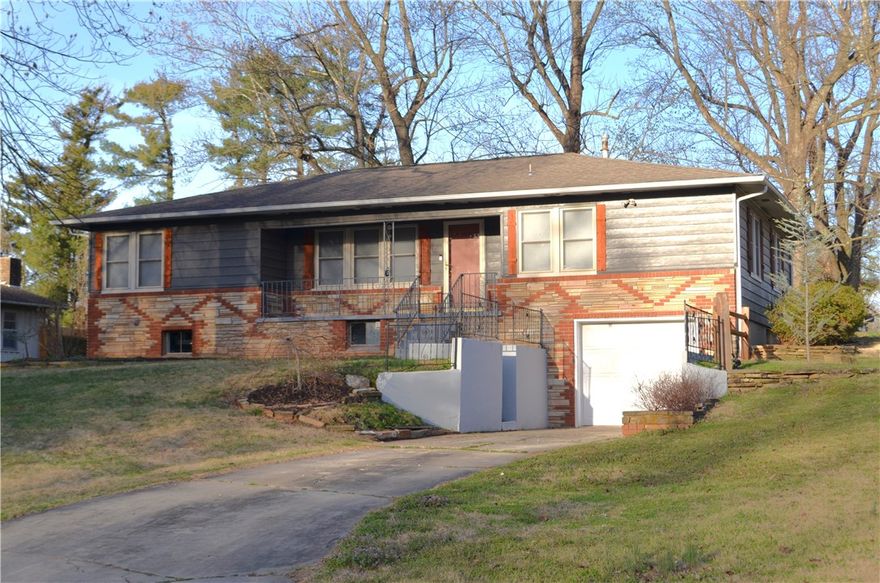 Charming Corner Lot with Endless Potential! This beautifully landscaped home sits on a desirable corner lot and offers fantastic curb appeal that welcomes you the moment you arrive. Inside, you'll love the open-concept layout that connects the living room and dining area. The vintage kitchen adds character and charm, offering a warm and nostalgic feel. The bedrooms have beautiful hardwood floor hiding under the carpet. Step outside to a flat backyard that’s ideal for relaxing evenings, gardening, or gatherings. One of the standout features of this home is the full unfinished basement. Whether you dream of the ultimate workshop, hobby space, or additional storage, the possibilities are endless. Even better, plumbing is already in place—making it easy to finish the basement and create additional living space if desired. For peace of mind, there is a safe room in the basements for stormy weather. This home offers character, flexibility, and room to grow—all in a great location. Come see the potential for yourself!