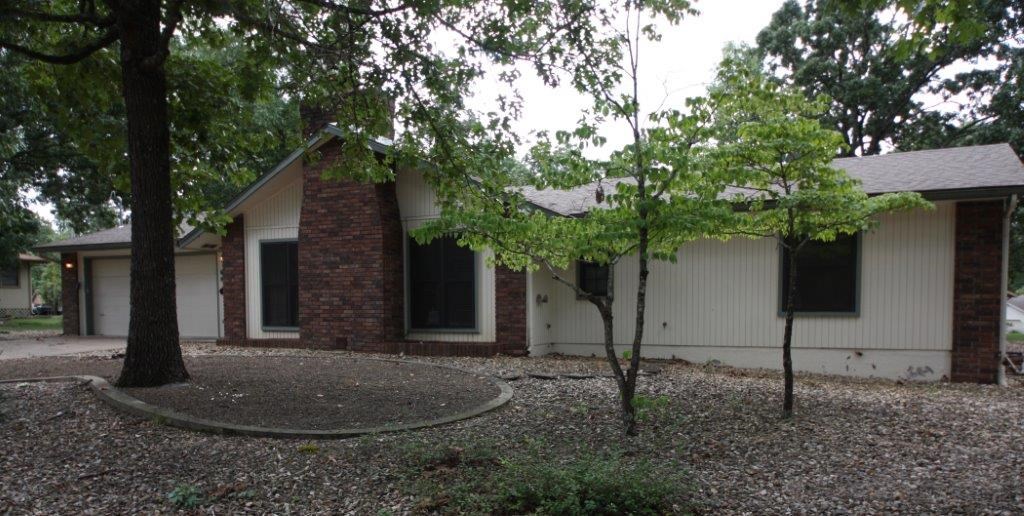 This is one not to miss! Easy location and home in great condition. Lots of storage. flat yard. Glassed in sun porch and wood burning stove in fireplace. Oversized garage with work bench.