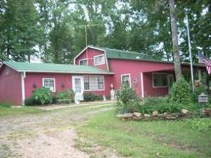 This small farm on 10 acres is fenced and cross fenced, complete with pond, freshwater creek, and multiple springs. several metal outbuildings, pole sheds, cattle panels, chute, etc. The secluded 3 bedroom 2 bath, 1368 s.f., split level home is roomy and comfortable with new flooring and all appliances. Heating and cooling is zoned, very affordable utilities. Covered parking by back door. Property includes mobile home pad with separate utilities and septic. Prequalified buyers, call for your show today.