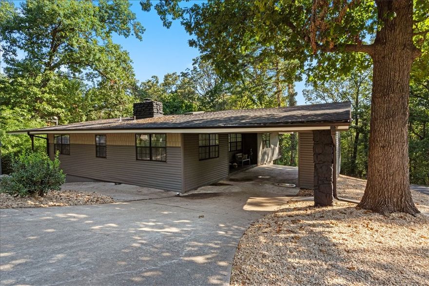 Stunning, move-in ready and walking distance from outdoor adventure, welcome to 3 Jackson Circle.
The owners have painstakingly brought this property from meh to marvelous; and the modern facelift gives a warm and cozy feel, with 3 bedrooms/2 baths upstairs, centered around a spacious living room that leads to a relaxing and private sun room; while the renovated downstairs area opens the potential for an in-law suite or a separate apartment.
And location...
With both Town Center and the Highlands districts close by, your dining and grocery shopping needs are within quick and easy access.
If you are into enjoying the outdoors, Bella Vista is home to more than 56 trails, covering 160 miles that are sure to provide a variety of adventure for years to come and, 3 of these trails surround the home while Tanyard Creek Nature Trail and the Country Club Golf Course are conveniently located nearby.
Come make 3 Jackson Circle your home base for relaxation, fun and adventure.
Currently permitted for 3 bedroom septic.