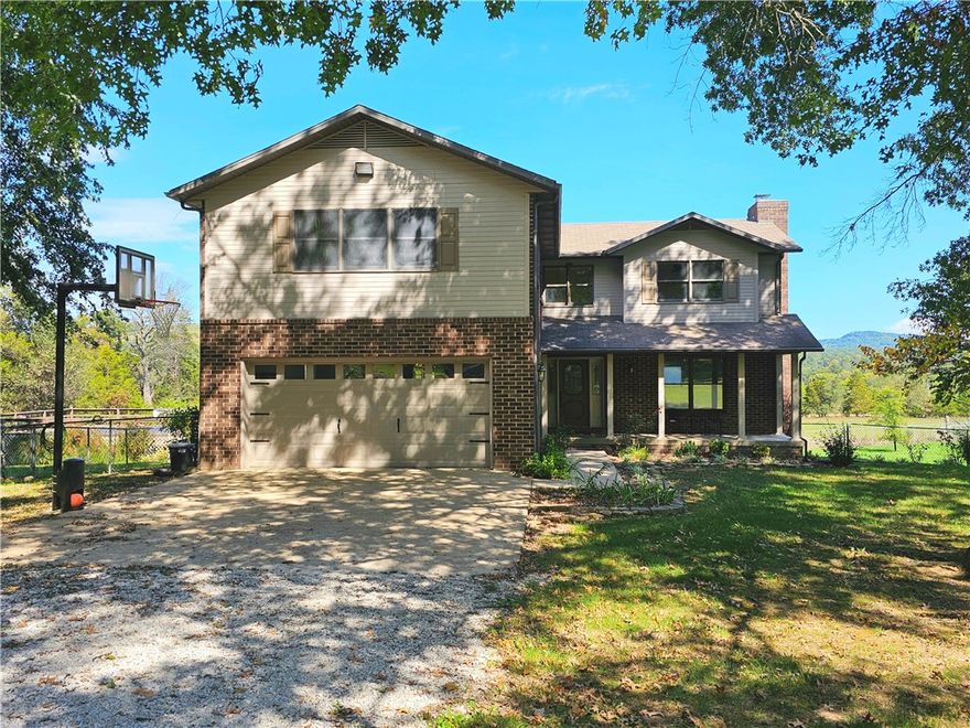 Welcome to your spacious 2,684 sqft home set on 16.47 serene acres. Perfect for comfort & country living. 4 bedrooms, 3.5 baths, fresh paint & new flooring throughout. Your home is move-in ready. The unfinished walk-out basement with full bath offers flexible living or guest space. Outside you'll find a 38x50 barn ideal for a workshop, plus 2-car garage & 2-car carport. The property is set up for livestock & has a chicken coop. Enjoy pear, apple, and cherry trees. Last but not least, a whole-home Generac generator.