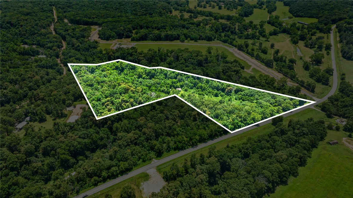 Whether you are looking for privacy to build or a place to develop, this one is for you. Located just outside of Centerton this 13.5 acre property consists of wooded and open areas, a wet weather creek along the west side of the property, multiple potential build sites and over 700ā of highway 102 frontage, but you wouldnāt even know it thanks to the border of trees that block noise and provide privacy. There is an unfinished non-permanent cabin and portable storage building on site that will be removed before closing unless negotiated for by buyer. Value of the property is as land only.