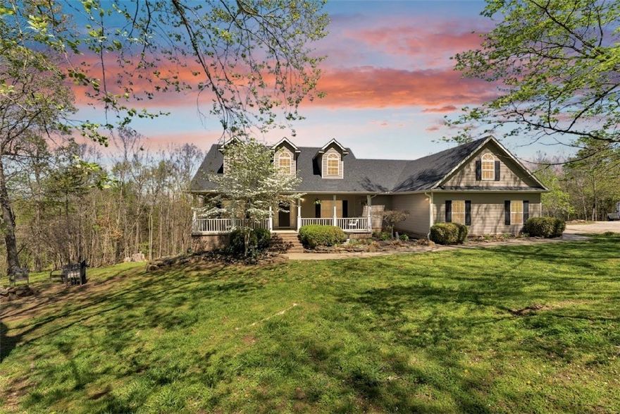 This stunning home sits on over 3 acres and offers breathtaking views you won’t want to miss. With over 4,300 square feet, the property features 5 spacious bedrooms and two full kitchens, perfect for multi-generational living or added flexibility.
The fully furnished basement provides its own private living space with its own private attached two-car garage, which is ideal for a mother-in-law suite, apartment, or potential Airbnb opportunity. Upstairs, you’ll find a desirable split floor plan, generous walk-in closets, and both formal and informal dining areas designed for everyday living and entertaining.
Enjoy peaceful mornings or relaxing evenings on the oversized front porch, all while being just a block away from Oakridge Golf Course.