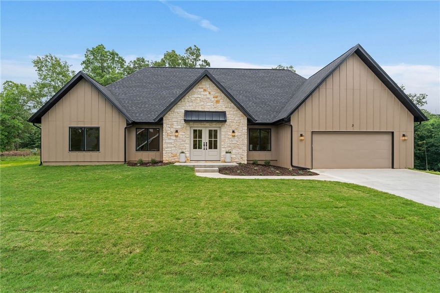 Luxury new construction on a rare FLAT .4 acre lot! Designed with timeless elegance and modern functionality, this home features a spacious open-concept living area, large bedrooms, custom cabinetry, over-sized garage, walk-in pantry, quartz countertops, designer finishes, and high-end details throughout. 

The exterior showcases natural limestone and SmartSide siding for exceptional curb appeal and durability. The kitchen is equipped with GE appliances, including a gas range, while an American Standard HVAC system provides year-round comfort. 

Additional highlights include an insulated laundry room and thoughtfully designed living spaces. Conveniently located .4 miles from Stoneykirk Boat Ramp and Park. Minutes from Branchwood Nature Trail, Rec Center, Pickleball courts, Frisbee Golf, Highland Golf Course, Pub and I-49.  Nearby Mountain Bike Trails proposed on Bella Vista’s Master Plan.  See video under "Virtual Tour Link". Agent Owned.