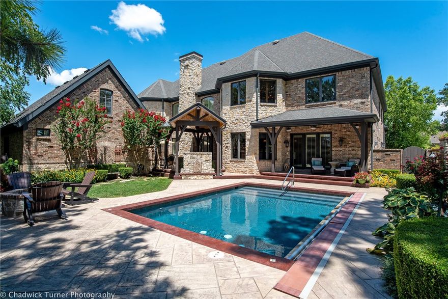 Custom, extensively detailed home in Pinnacle located in a private cul-de-sac. 100% stone & brick
detailing, featured landscape design, pointed "Gothic" arches highlighted throughout! Oversized rooms, 3 living areas, Bonus with wet bar, media, elevator,executive study, extensive built-ins with custom hand finishes, coffee bar, hidden "Narnia Room", incredible kitchen! 5 oversized garage bays-2 are heated/cooled w/ bonus&bath. Private in-ground pool with treetop views, outdoor fireplace & built-in grill!