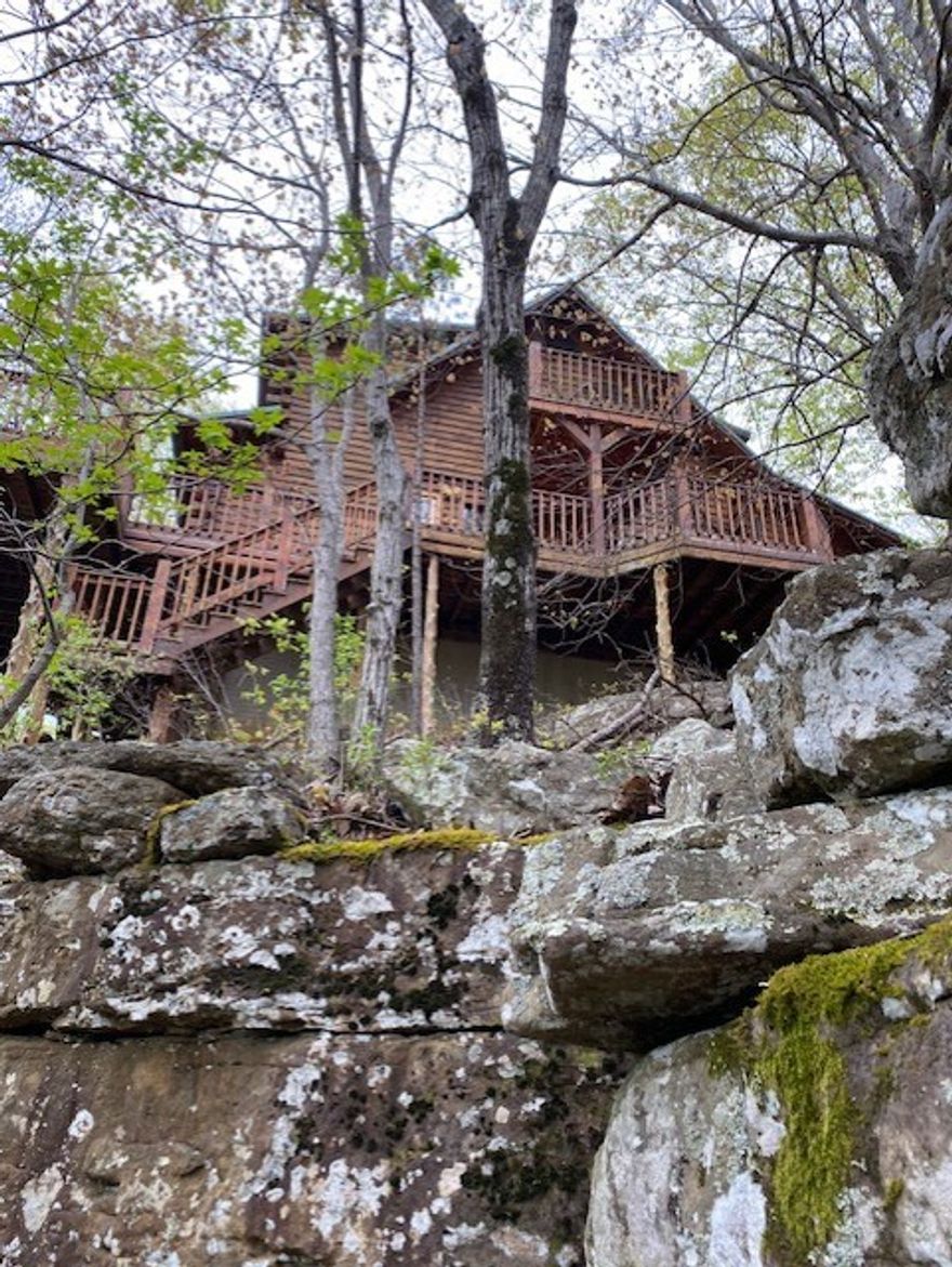 OZARK BLUFF DWELLERS CABINS 
Buffalo National River, the crown jewel of the breathtaking Ozark Mountains, offers a diverse range of outdoor activities including canoeing, kayaking, rock climbing, hiking, camping, mountain biking, caving, horseback riding, swimming, hunting, birding, fishing, and photography. The Ozark Bluff Dweller cabins, located on a high rock bluff overlooking the most picturesque section of the Buffalo River, provide the perfect base for exploring this stunning region. The cabins are connected to the Buffalo River Trail via a hiking trail, which spans the entire 135-mile length of the river. Raney Cove Waterfall and Bluff Shelter are nearby, accessible via a short hike from the cabins. THE THREE CABINS are situated on a private road and are located about 5 miles west of the charming village of Jasper, Arkansas. Spaced about 1/4 mile apart, they offer good privacy and incredible views of the Buffalo River National Park from their high bluff location.
