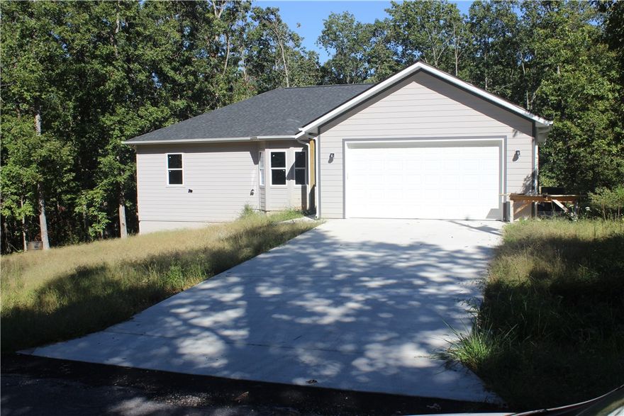 Brand new home with with lots of care and consideration. Custom cabinets with soft close doors and drawers, pull out bean shelves in lower corner and spice rack pull out next to stove. Bright, open and inviting living area complete with large pantry and large bar for seating. Barn doors in laundry room and master bathroom, walk in master closet with transom window for light during the day. Tile shower and baths, dual sinks, large covered deck with steps down to concrete slab leading to workshop underneath. Over sized garage with 220 Electric car plug in on wall. House is not yet finished please be careful walking around. Builder will contribute $500 for Knobs and handles in the kitchen and laundry room.