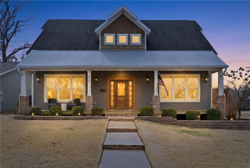 Walkable downtown Bentonville living just minutes from the Square, Crystal Bridges, and the Razorback Greenway. This Craftsman-style home delivers rare amenities—including a private hot tub terrace and wine cellar/speakeasy—paired with true lock-and-leave convenience in one of the city’s most sought-after locations.

Offering 4,148 sq ft across three levels, the main floor features wood beams, custom built-ins, hardwood floors, and a chef’s kitchen with granite counters, dual ovens, farmhouse sink, and walk-in pantry. The finished lower level includes a custom wine cellar and tasting room, plus dedicated fitness space. The main-level primary suite offers a spa bath and private terrace with built-in hot tub. A curated outdoor entertaining courtyard provides privacy without the maintenance of a large yard. A rare opportunity to secure scale and curated amenities within one of Bentonville’s most desirable downtown corridors.