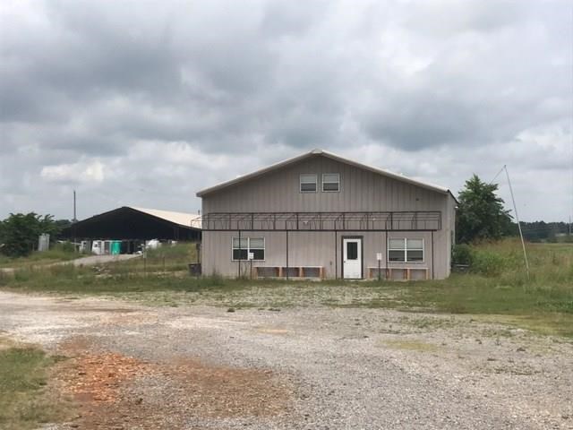 Large space for warehouse, manufacturing, and office space. Loading dock in main warehouse, lots of possible uses for flexible floor plan, 3 additional pole sheds on site.