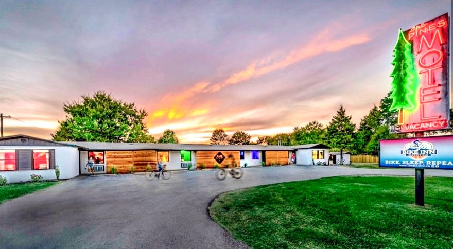 Following a complete ground-up renovation, this property has evolved from an historic lodging site into a highly recognized, four-star boutique destination in the heart of Bentonville’s nationally celebrated art, dining, and trail scene. The property features 13 rentable rooms with 16 queen beds, including a private cottage, four stand-alone cabins, and four RV sites. Flexible use allows nightly, mid-term, long-term, and full-property event rentals. Each room includes custom in-room bike storage & locally curated art & decor. Amenities include a hot tub, sauna, cold plunge, bike wash and work stations, hammock area, outdoor fire pit, pavilion, and grilling area. Ownership will consider multiple purchase options including owner financing, continued management, and transfer of business and personal property (see listing attachments for further details). View the Virtual Tour Link for a self-guided, interactive tour. Financials available upon request.