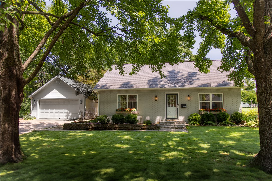 Welcome home to this charming 4-bedroom, 2.5-bath which home offers unbeatable walkability to the Square, Crystal Bridges, Orchards Park, the Momentary, and top-rated schools—with easy access to I-49 and local trails. Nestled on a shady lot with mature trees, window boxes and a backyard shed, this two-story home combines purposefully designed modern updates with classic comfort. Inside, the open floor plan centers around a custom kitchen featuring quartz countertops, double wall ovens, a gas range with hood, and island seating. The main level includes a formal dining room, breakfast nook, home office/guest room, and a quiet front sitting room ideal for a music room or library. The spacious primary suite was fully remodeled in 2017 with a sleek modern bathroom and walk-in shower. A thoughtfully designed mudroom with custom pegboard storage adds everyday functionality. Additional updates include a mini split (2024) and brand-new carpet (2025). A rare find with style, space, and location all in one.