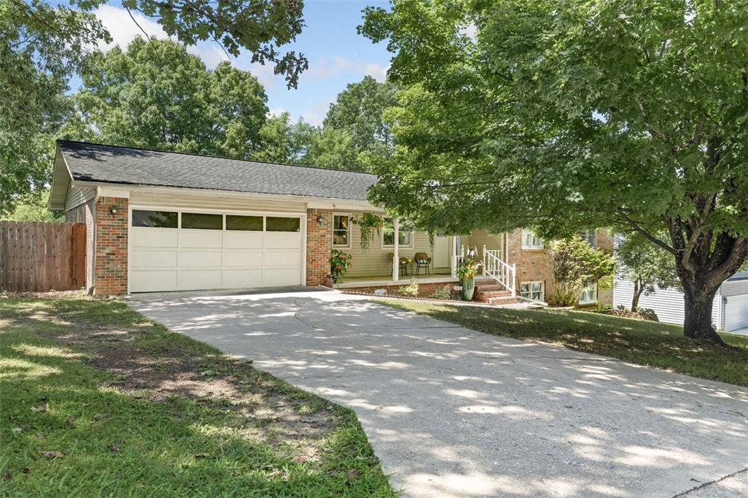 Looking for a 4 bed 3 bath home? This all brick home features a large open living room with a wood fireplace, lovely kitchen with abundant cabinetry, plus a separate dining room and oversized laundry room. On the main level you have 3 spacious bedrooms with w full baths. The primary suite features double walk-in closets. In the basement you have 2 multipurpose rooms. One is currently used as a den and the other has been used as a bedroom with a Jack and Jill bathroom in between. You also have a 15x52 garage for double parking or all of your storage needs. The home is situated on a quiet private cul de sac, with a fenced in backyard and large deck perfect for outdoor entertaining.