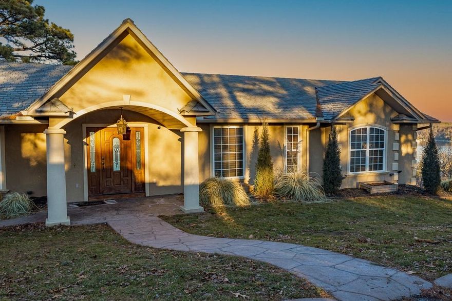 This Beaver Lake property in Crows Nest Subdivision offers a breathtaking view of the lake overlooking the Hwy 12 bridge, featuring a high-end home theater, indoor/outdoor music zones, an outdoor kitchen with a commercial pizza oven, three decks, a gourmet kitchen with KitchenAid appliances, an advanced security system, 5 external cameras, 2 fireplaces, a bar, and a game room with a band stage. The primary suite includes a luxurious spa with a jetted tub and a tiled shower. It has floor-to-ceiling windows for panoramic views and natural light, plantation shutters, two private bedrooms downstairs for guests, and a basement ready for customization. The roof is DaVinci composite.  The home requires some TLC and is priced accordingly.