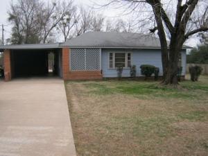 IMPECCABLE INSIDE & OUT! Delightful home is immaculate with loads of personality! Built in shelves, adorable kitchen, workshop area, storm cellar, covered porches, extra patios, gorgeous lawn! Hardwood floors under carpet in huge family room. All kitchen appliances convey including massive chest freezer. Extra parking on this lot and a half!