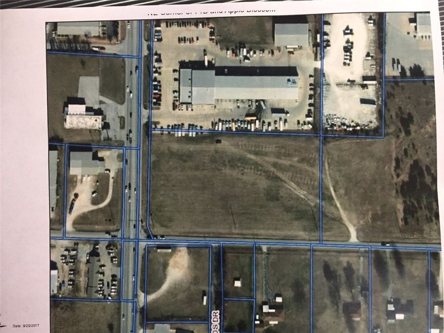 Highly visible 5.05 Acres (MOL) on Hwy 71B in Lowell.  Zoned Commercial with road frontage on 2 sides.  Flat with and easy to build on.  All utilities on site.