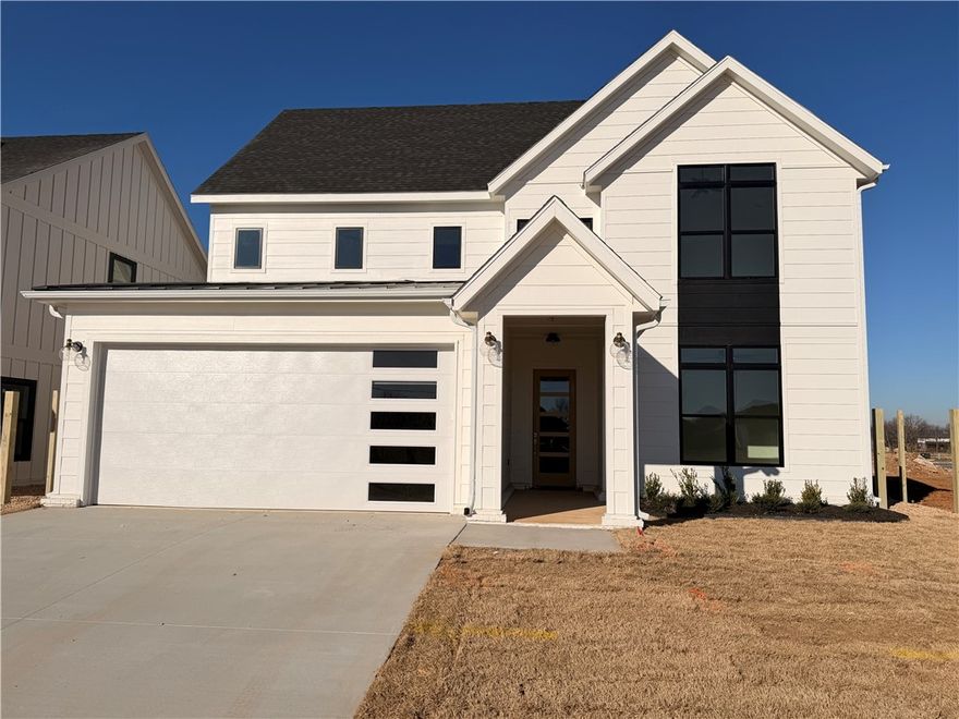 Welcome to Meadow Brook in SW Rogers! Great community in the best location! This plan features 3-4 bedrooms (2 flex spaces either bedroom 2 or study option as well as upstairs bedroom 4 or bonus room). All bedrooms have walk-in closets with plenty of storage! Downstairs you will find the primary bedroom. Great layout with open kitchen/living room area. Kitchen has large island to sit up to 6 bar stools, built-in gas cook top, built-in oven and microwave, large pantry, and eat in dining area. Primary bedroom feature en suite bathroom with soaking tub, walk-in shower, his and hers separate vanities, and large closet with lots of built-ins. Bedrooms 3 & 4/bonus room are upstairs along with a full bathroom. Enjoy the evenings grilling on the covered back patio! Can't beat location being only minutes to shopping, dining, groceries stores, and only steps to the Razorback Greenway Trail.