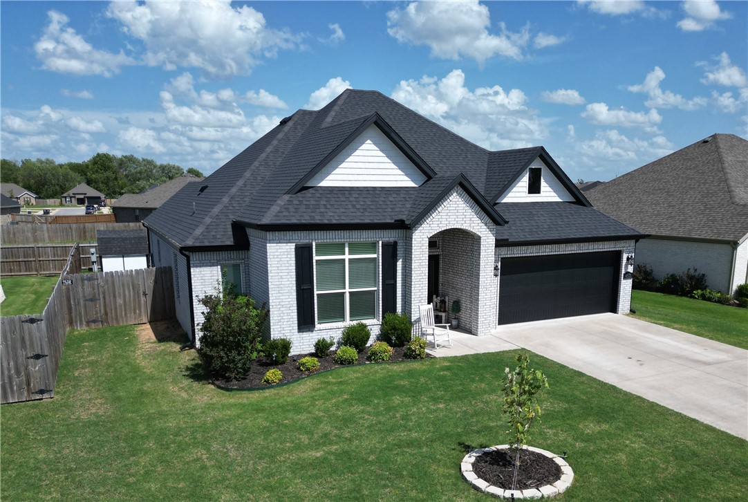 This is the home youāve been waiting for in the desirable Hylton Subdivision! This beautifully maintained single-level home feels like new and offers an ideal blend of comfort and style. Step inside to a stunning entryway that opens to a bright, airy living space featuring a cozy gas log fireplace and an open-concept kitchen with granite countertops, a walk-in pantry, and plenty of natural light. The primary suite is a true retreat, showcasing a cathedral ceiling with stained wood beams, a luxurious jacuzzi tub, and walk-in closet. Every detail has been thoughtfully designed, from the quality finishes to the functional layout. Outside, the home boasts incredible curb appeal with its light brick exterior and contrasting dark roof. The fully fenced backyard includes a covered patio perfect for relaxing or entertaining, along with an attractive storage building for added convenience and storage. Convenient location and move-in readyāthis home checks all the boxes!