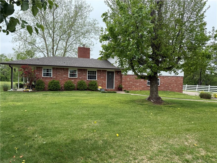This Home is part of and being sold with Parcel # 02-00170-000 MLS # 1305931 consisting of 2.14 acres plus this .32 of an acre for a total of 2.46 acres of prime development property close to Downtown Rogers and Beaver Lake. Price is 885,000 for both pieces of property.