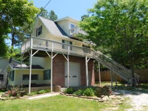 Considering an Air B & B or Life in a Small Home?? Chalet Style home with garage on ground floor, main floor above garage plus 3rd floor Bonus Area!! main floor has deck with view, open living, dining, kitchen combo, bedroom, full bath and washer/dryer area, 3rd floor is large open area plus a full bath, could be your master suite with sitting area or double shared bedroom plus a balcony with terrific view!! Ground floor garage has plumbing available so it could become an apartment or make it your garage/shop for business or hobbies. This home had a kitchen fire, interior is all new including sheetrock, floor coverings, kitchen cabinets & appliances, bathroom fixtures, light fixtures, electrical, CH&A units, etc. Multiple Offers Received, seller requests best offer by 4:00 pm Thursday 6/9