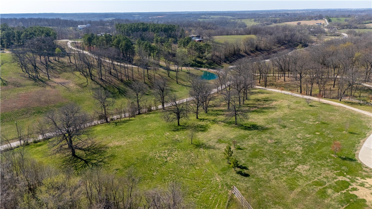 One of the most breath-taking views in ALL of NWA ! Come see for yourself. Picturesque 2.24 acres awaits your dream home. Once you stand on your future home site, you'll feel miles away from all the hustle and bustle of town, yet, only 2 minutes from HWY 112 or I-612. Amazing, One-of-a-Kind location surrounded by multi-million dollar estates. This "west" Benton County location is 5-Star & in one of the most appreciating zip codes in all of NWA. Acreage like this is next to impossible to find in this upscale, close to everything location. Come see for yourself.