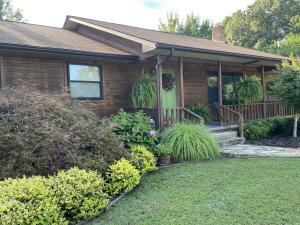 This beautiful 3750 (finished) sq ft, 5 bedroom, 3 bath home on an estimated 1.75 ac is located in the heart of the Ozarks and Valley Springs School district with awesome views of the surrounding mountains.One story cedar wood sided, asphalt shingle roof, ranch style home on a full partially finished concrete walkup basement. 3 bedrooms, 2 baths, foyer/entry, living room, kitchen, breakfast, dining and utility/laundry on the main floor. The basement area is finished with 2 bedrooms, 1 bath, a family room, den and unfinished mechanical and storage rooms. The home is accented with a 2 car attached garage, covered front porch, screened rear porch and extended open wood deck with a 900sf open front pole barn/shed and wood fenced yard with a asphalt driveway.