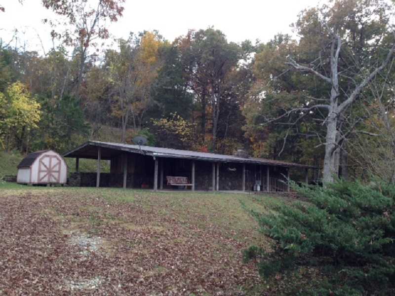 Home on 1.98 Acres built in 1970 with 2 bed/1bath. Laundry room detached. Detached storage building. Window Air and Propane wall unit for heat with propane for emergency. Storage Building 10x10.Open Porch.