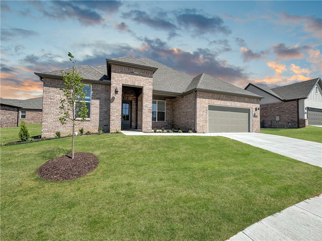 Riverwalk is one of Fayetteville's most unique subdivisions that was designed for perfection. It is located in East Fayetteville, just 10 minutes from the Fayetteville Square, filled with downtown entertainment and a variety of restaurants. This subdivision includes a community pool, walking trails, and river access. Welcome to Phase V Riverwalk, centrally located to all that Northwest Arkansas has to offer. This brand-new home will have LVP throughout. Kitchen will have 42-inch cabinets, stainless steel appliances, and quartz countertops! Living room will have a beautiful gas log fireplace with painted brick surrounds and white mantle. Cased windows in the living, dining, and bedroom one. The bedroom one will have dual sinks and quartz countertops, oversized walk-in shower. High-efficiency air conditioning system with programmable Wi-Fi thermostat. Exterior of homes will be brick or Brick/ LP Smart Siding per plan. Taxes and Parcel TBD.