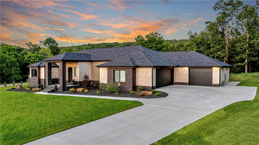 Exquisite like-new custom home in the Knolls subdivision in Goshen completed in 2023. Custom metal fireplace surround anchors the great room with white oak flooring and 12-foot ceilings. Spacious gourmet kitchen with large island, side-open double ovens, 5-burner gas cooktop, extensive wood cabinets, farm sink and built-in refrigerator. Walk-in pantry offers wine fridge and added storage. Primary bedroom connects to a large master bath with glass shower, dual vanities plus an exterior door for convenience to the hot tub. Massive master closet opens to the laundry room with extra sink and mud space. Carpet and walk-in closets in all bedrooms. The 3-bay garage has textured epoxy floors and 4th utility bay. Hot and cold hose bibs in the garage and outside. Extra storage, recessed lighting, quartz countertops, ceiling fans and blackout roller shades throughout. Extensive landscaping on a 1.08-acre corner lot with sprinkler system and covered porches. Immaculate condition with many upscale features.