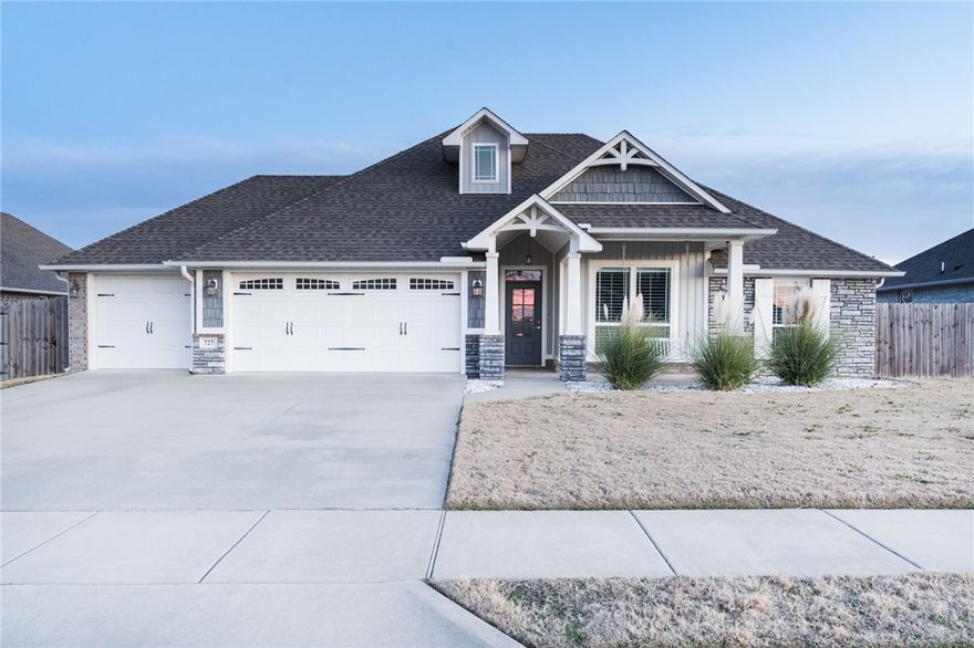 This beautifully maintained 3-bedroom, 2-bath home with a 3-car garage offers 1,651 sq ft of thoughtfully designed living space and standout upgrades throughout. The inviting exterior features a covered front porch with bench swing, plus a covered back patio with extended patio area—perfect for entertaining. Enjoy added privacy in the fully fenced backyard, enhanced with low-maintenance AstroTurf and tasteful rock landscaping. Inside, you’ll find plantation shutters throughout, wood-look tile flooring, and a cozy gas log fireplace. The eat-in kitchen boasts a beamed ceiling, deep single-basin sink, five-burner gas cooktop, and Frigidaire Gallery Series oven and microwave, with the refrigerator conveying. The primary suite offers comfort and space, while the primary bath features a deep soaking tub, split vanities, and a multi-head tiled shower. A standout feature is the insulated single-car garage with window A/C, ideal for a home gym, workshop, or hobby space, in addition to the two-car garage.