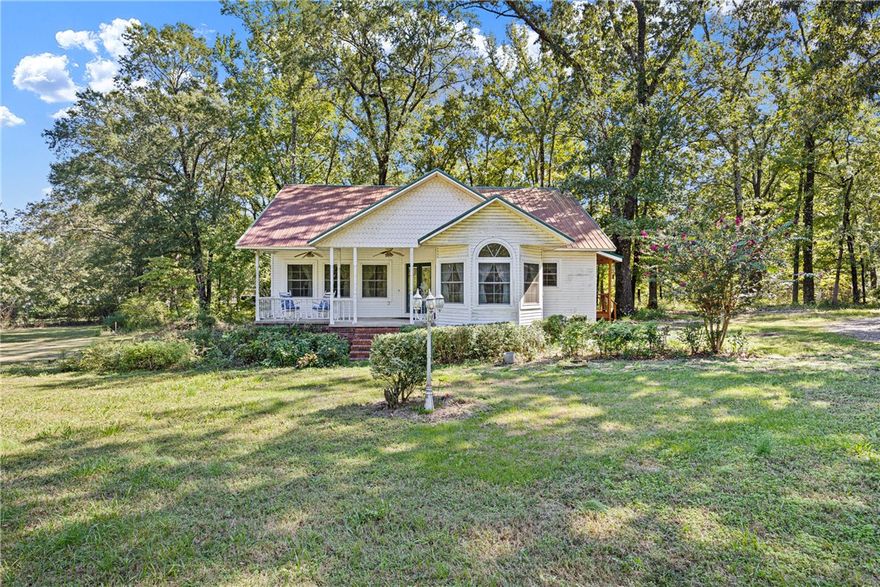 Tucked just moments from Lake Nimrod, this darling Plainview cottage overflows with warmth, whimsy, and personality! Resting on .81 acres surrounded by trees, it’s the perfect blend of privacy and proximity to all the outdoor fun—boating, fishing, hiking, and peaceful evenings under the stars. Step inside and you’ll instantly feel at home with cozy touches, tall ceilings, and character in every corner. The inviting layout flows easily from room to room, offering charming details you won’t find in cookie-cutter homes. A comfortable primary suite, welcoming living area, and bright kitchen make this home as functional as it is unique. Outside, there’s plenty of space to garden, relax, or simply breathe in the quiet. Whether you’re looking for a weekend retreat or a full-time escape, this sweet spot near Lake Nimrod is that rare find that feels equal parts storybook and sanctuary.