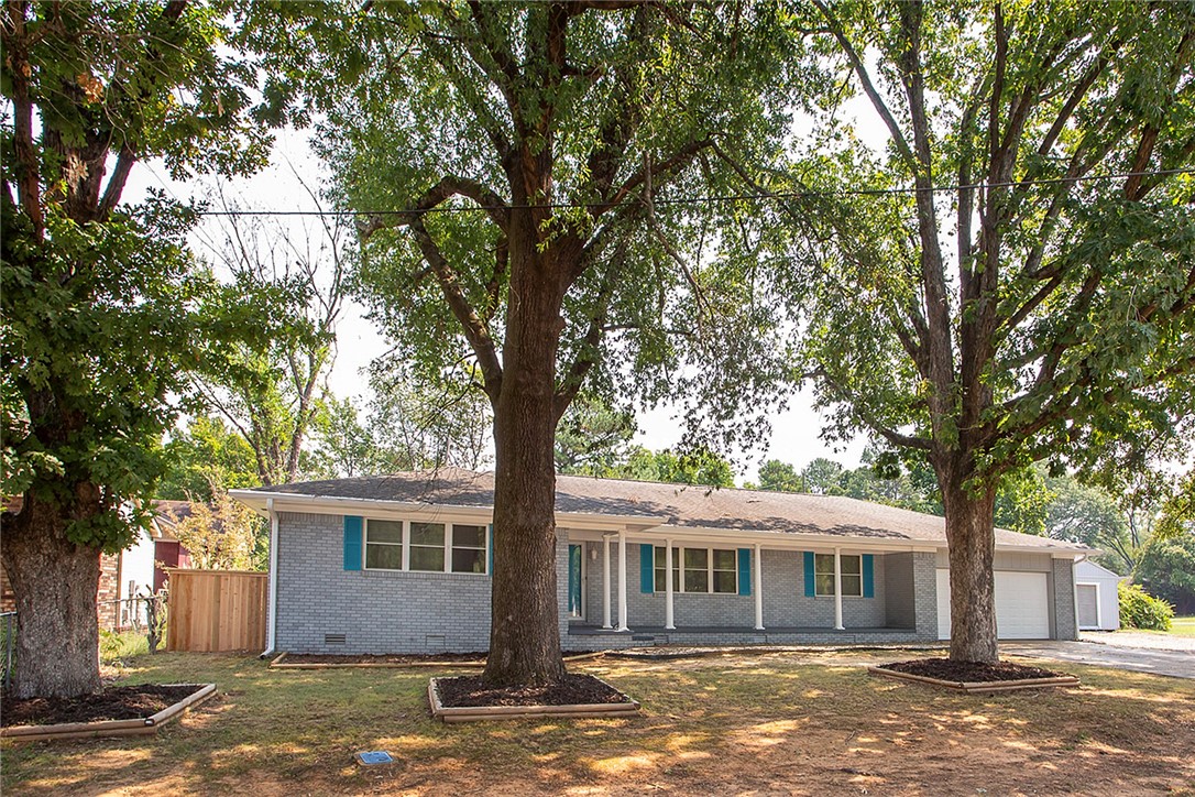 Freshly renovated, move-in ready, and set on two lots, this home blends style with space. Offering 2,588 sq ft of living space plus a 444 sq ft heated and cooled garage, it features 4 bedrooms, 2.5 updated bathrooms, and modern finishes throughout. The kitchen stands out with a gas range, quartz countertops, and stainless steel appliances. New luxury vinyl plank flooring and carpet keep the home feeling fresh, while updated vanities and showers bring a polished touch to the bathrooms. Outside, enjoy a wood privacy-fenced yard and a brand-new covered deck, perfect for entertaining or relaxing. With .58 acres, thereās room to spread out while staying conveniently close to town. Easy to show, schedule your personal tour today!